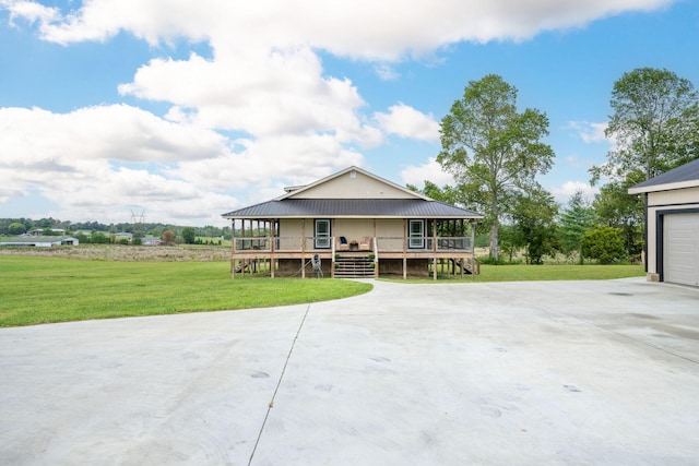 view of front facade with a front lawn, a porch, and a garage