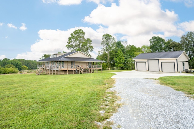 view of front of house with a front lawn, a deck, and a garage