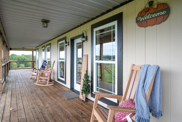 wooden deck featuring covered porch