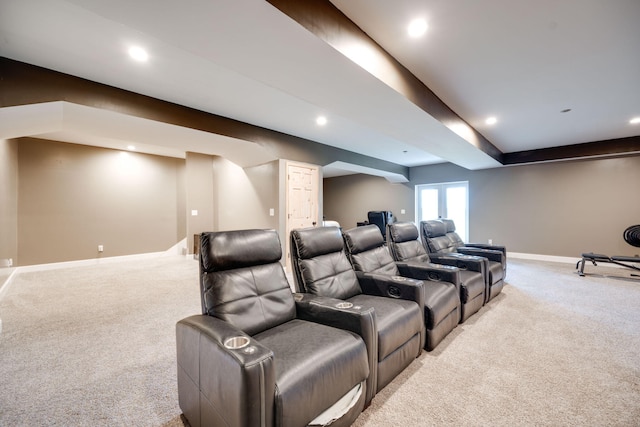 home theater room featuring light carpet