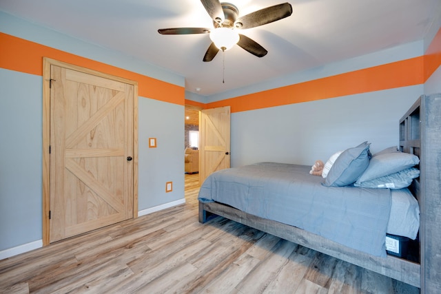 bedroom featuring light wood-type flooring and ceiling fan