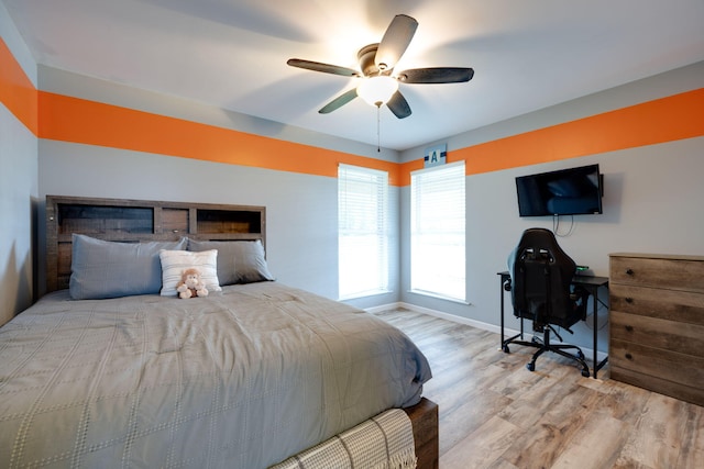 bedroom featuring ceiling fan and light hardwood / wood-style floors