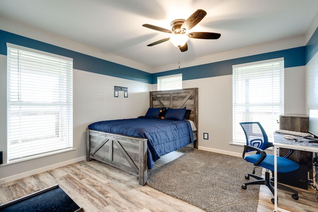 bedroom featuring ceiling fan and hardwood / wood-style floors