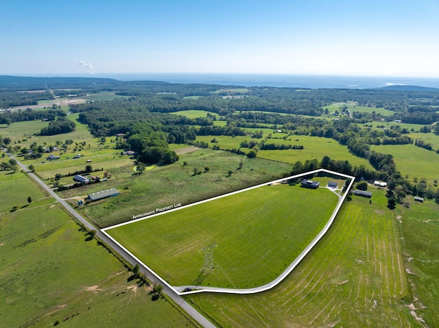 birds eye view of property with a rural view