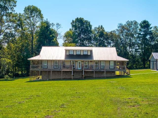 back of property with a lawn