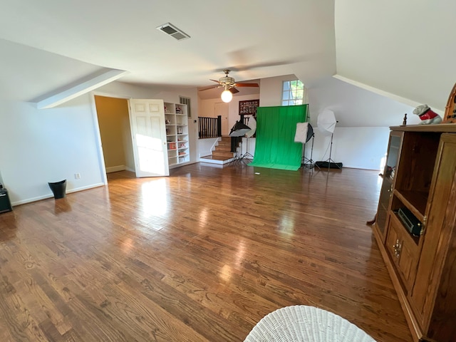 bonus room featuring ceiling fan, dark wood-type flooring, and vaulted ceiling