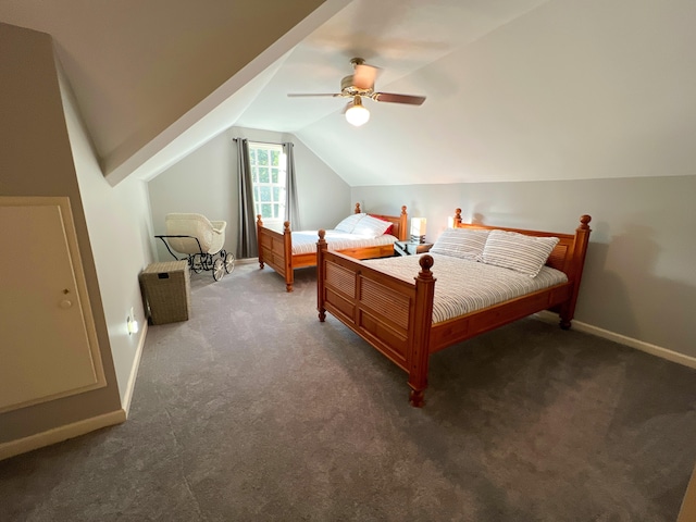 bedroom featuring ceiling fan, dark carpet, and lofted ceiling