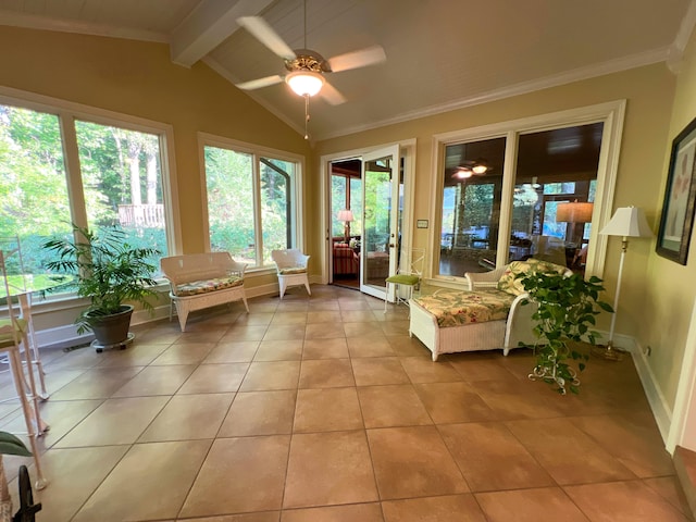 sunroom / solarium with a wealth of natural light, ceiling fan, and lofted ceiling with beams