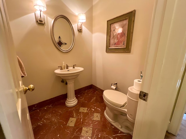 bathroom featuring toilet