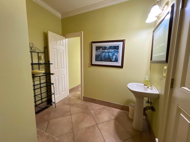 bathroom with tile patterned flooring and ornamental molding