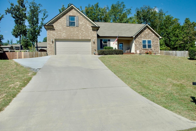 view of front of property with a garage and a front lawn