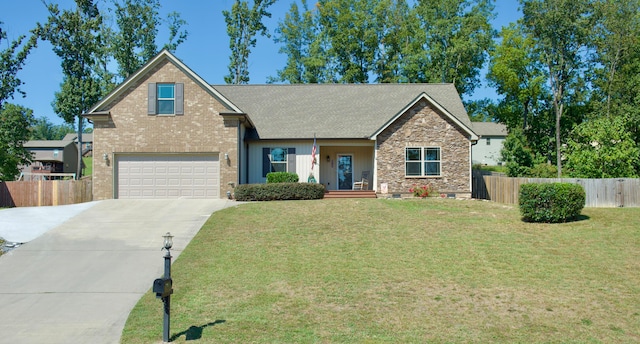 view of front of home featuring a garage and a front lawn