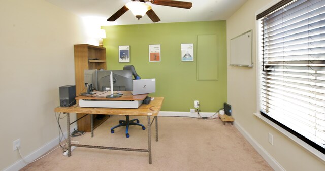 office area with light carpet and ceiling fan