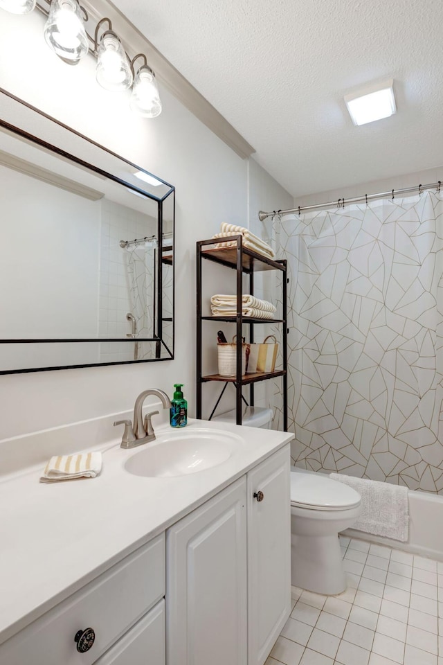 full bathroom with a textured ceiling, tile patterned flooring, vanity, and toilet