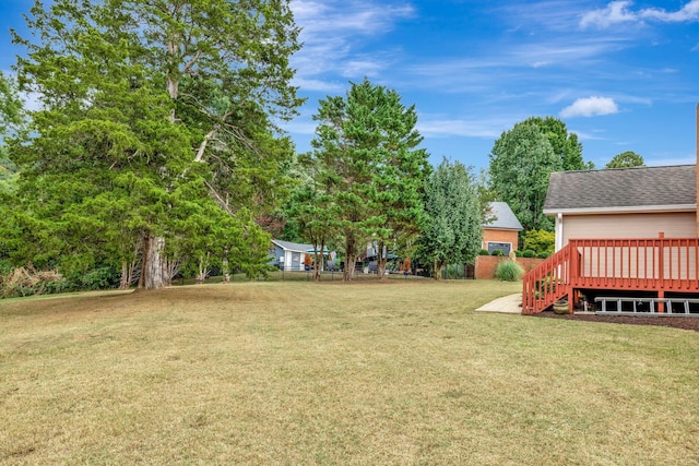 view of yard featuring a wooden deck