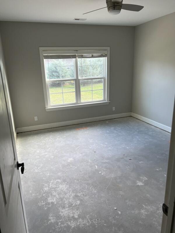 unfurnished room with ceiling fan