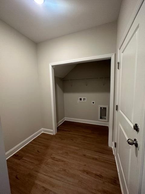 laundry room with hookup for a washing machine, electric dryer hookup, and dark wood-type flooring