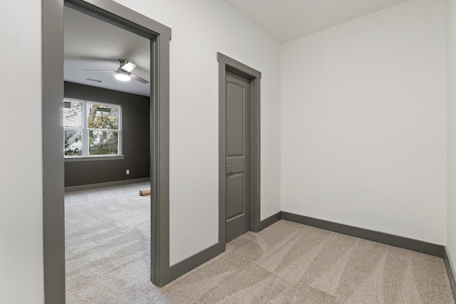 interior space featuring light colored carpet