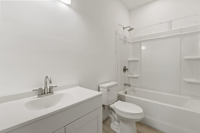 full bathroom with toilet, vanity, wood-type flooring, and tub / shower combination