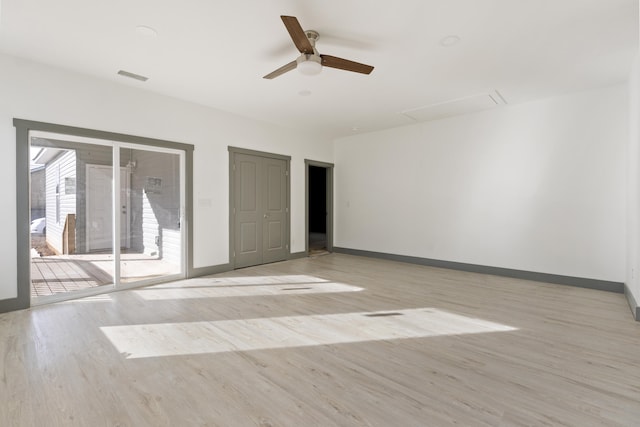 spare room with light hardwood / wood-style floors and ceiling fan