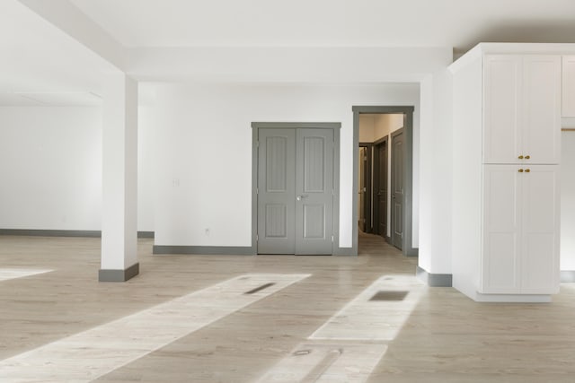 spare room featuring light hardwood / wood-style floors