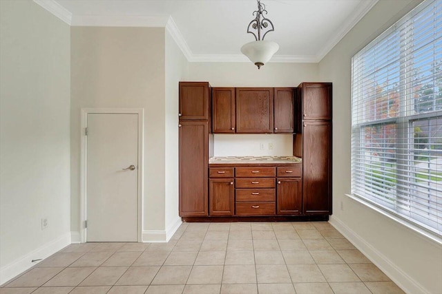 kitchen with pendant lighting, a wealth of natural light, and ornamental molding