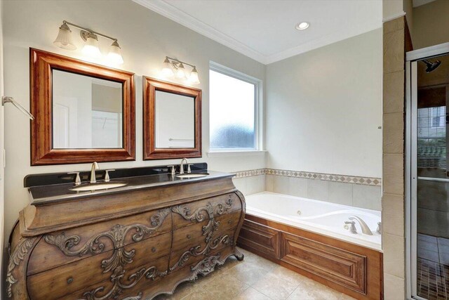 bathroom featuring ornamental molding, a tub to relax in, and vanity