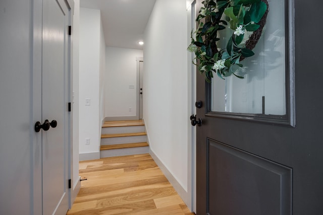 doorway featuring stairway, wood finished floors, recessed lighting, and baseboards