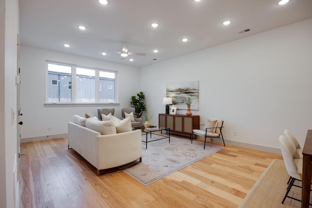 living room with visible vents, wood finished floors, ceiling fan, and recessed lighting