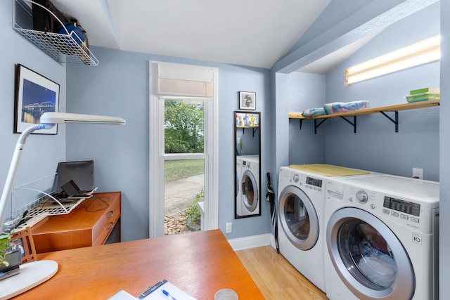 laundry area featuring light hardwood / wood-style flooring and washer and dryer