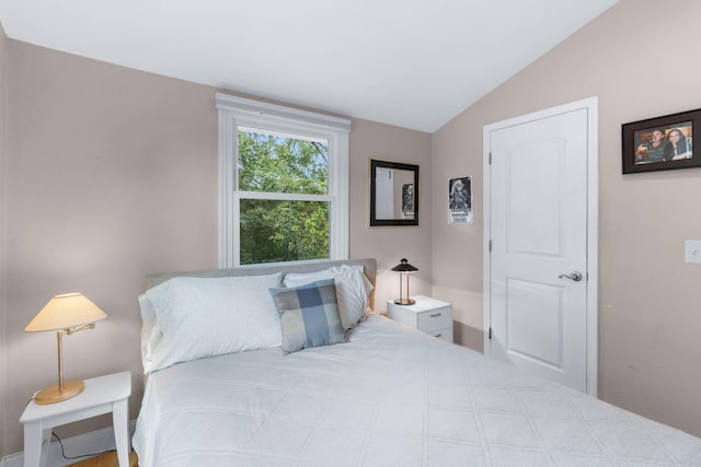 bedroom with lofted ceiling