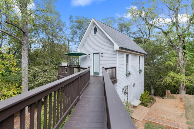 back of house featuring a wooden deck