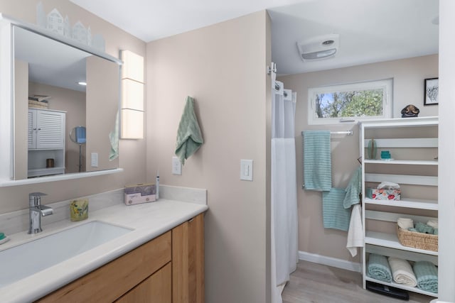 bathroom featuring wood-type flooring and vanity