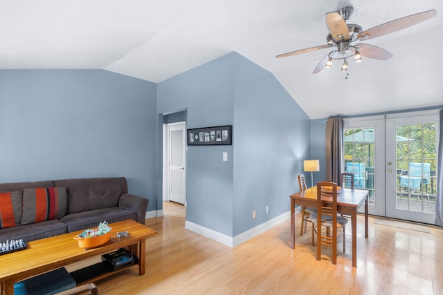 living room with ceiling fan, light wood-type flooring, french doors, and lofted ceiling