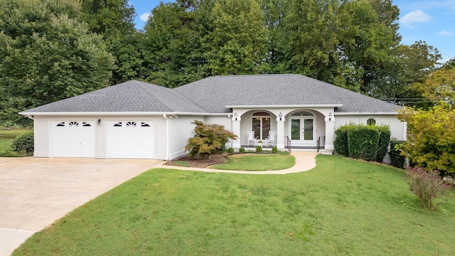 single story home featuring a garage and a front lawn