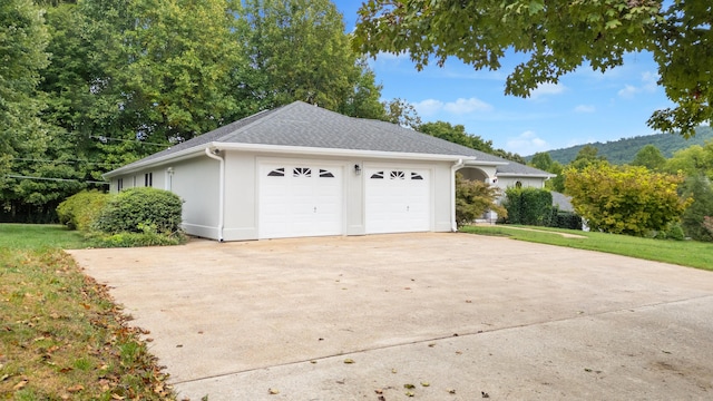 view of side of property with a garage