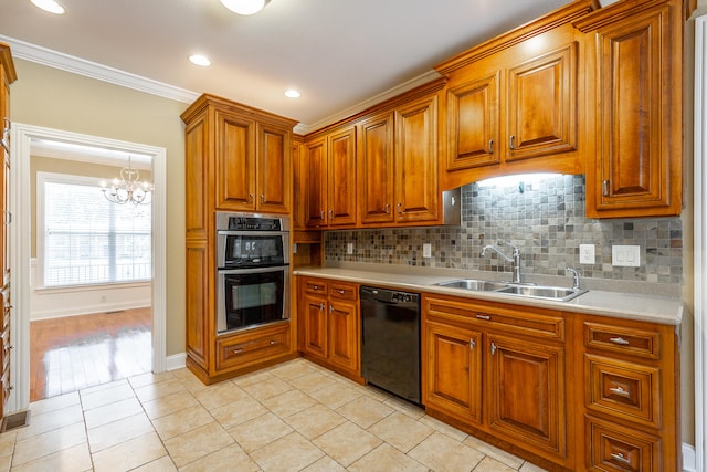 kitchen with dishwasher, stainless steel double oven, crown molding, sink, and a notable chandelier