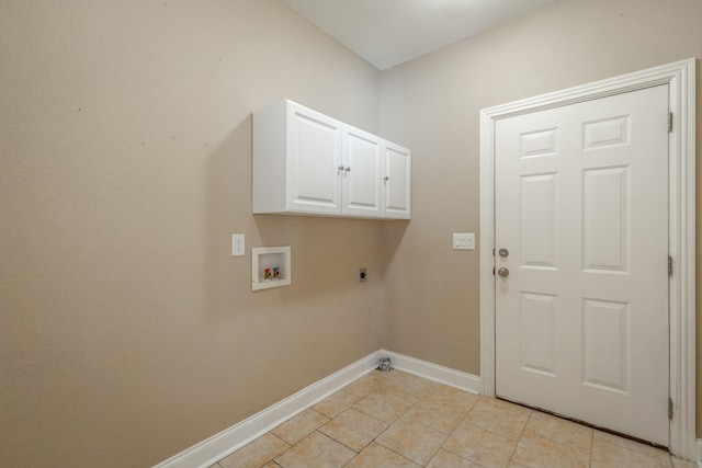 laundry area with hookup for a washing machine, cabinets, light tile patterned floors, and hookup for an electric dryer