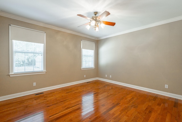 spare room featuring ornamental molding, ceiling fan, and hardwood / wood-style flooring