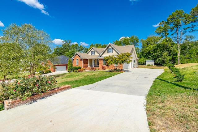 view of front of house with a garage and a front yard