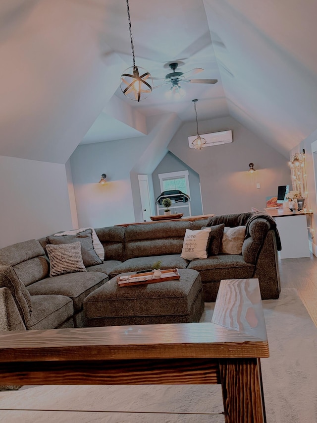 living room with vaulted ceiling, hardwood / wood-style floors, and ceiling fan