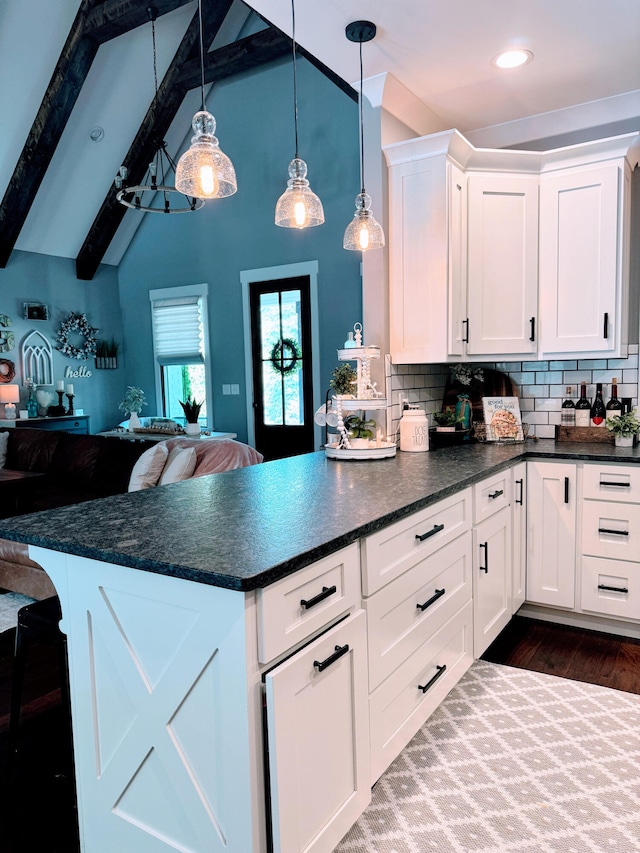 kitchen featuring white cabinets, beam ceiling, dark wood-type flooring, and tasteful backsplash