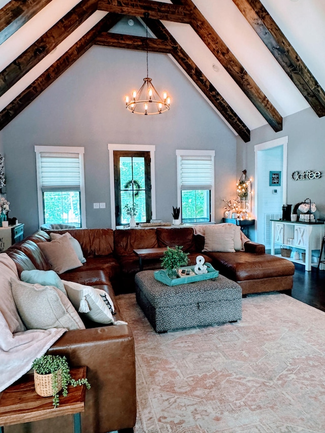 living room with beam ceiling, a chandelier, and high vaulted ceiling