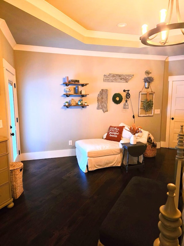 living area featuring crown molding and hardwood / wood-style floors