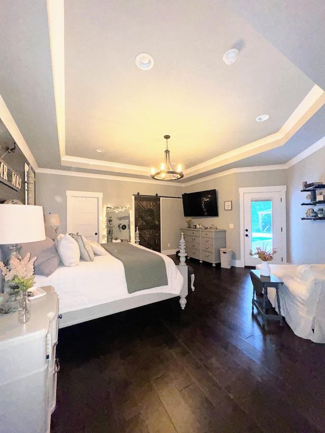 bedroom with an inviting chandelier, crown molding, a tray ceiling, and dark hardwood / wood-style flooring