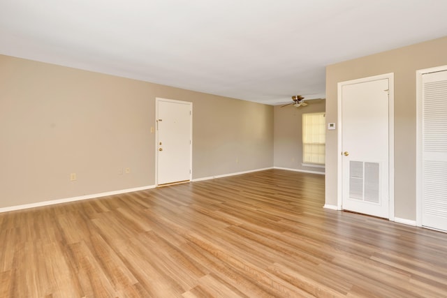 unfurnished room with ceiling fan and light hardwood / wood-style flooring