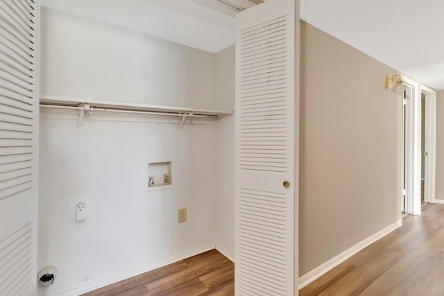 laundry area with washer hookup and hardwood / wood-style floors