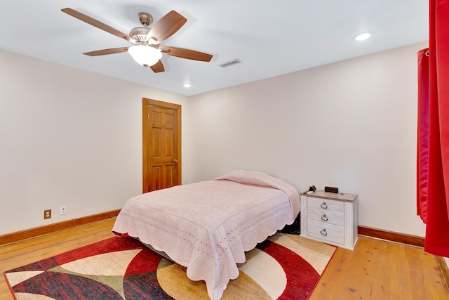 bedroom featuring light hardwood / wood-style floors and ceiling fan