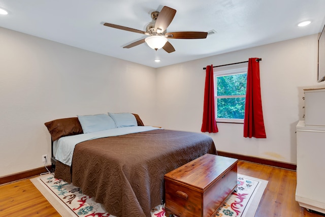 bedroom featuring light hardwood / wood-style floors and ceiling fan