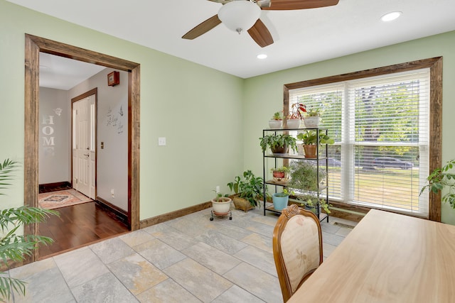 office space featuring light hardwood / wood-style flooring and ceiling fan